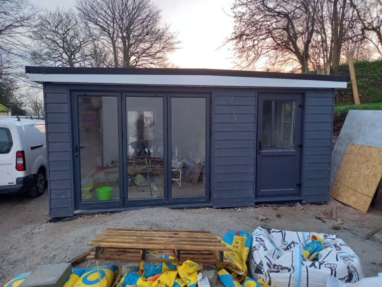 A complete living space with bedroom, bathroom and kitchen