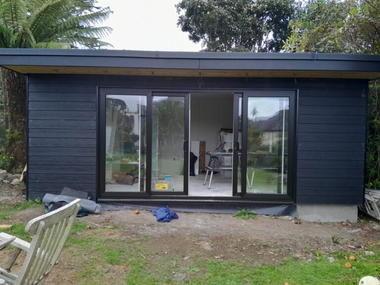 Large garden room with shower room, black Cedral cladding