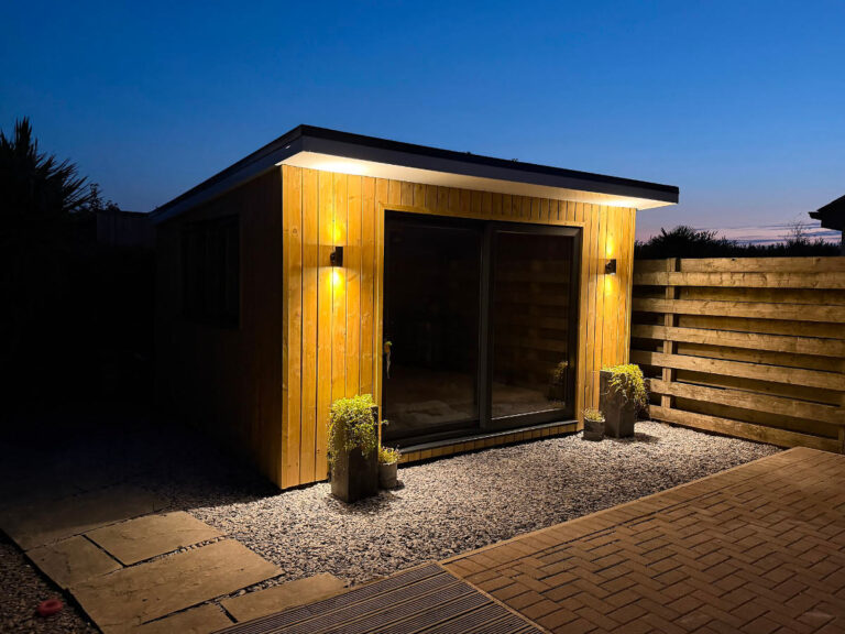 A custom pottery studio with vertical Canadian redwood cladding combined with Plastisol sheet metal.